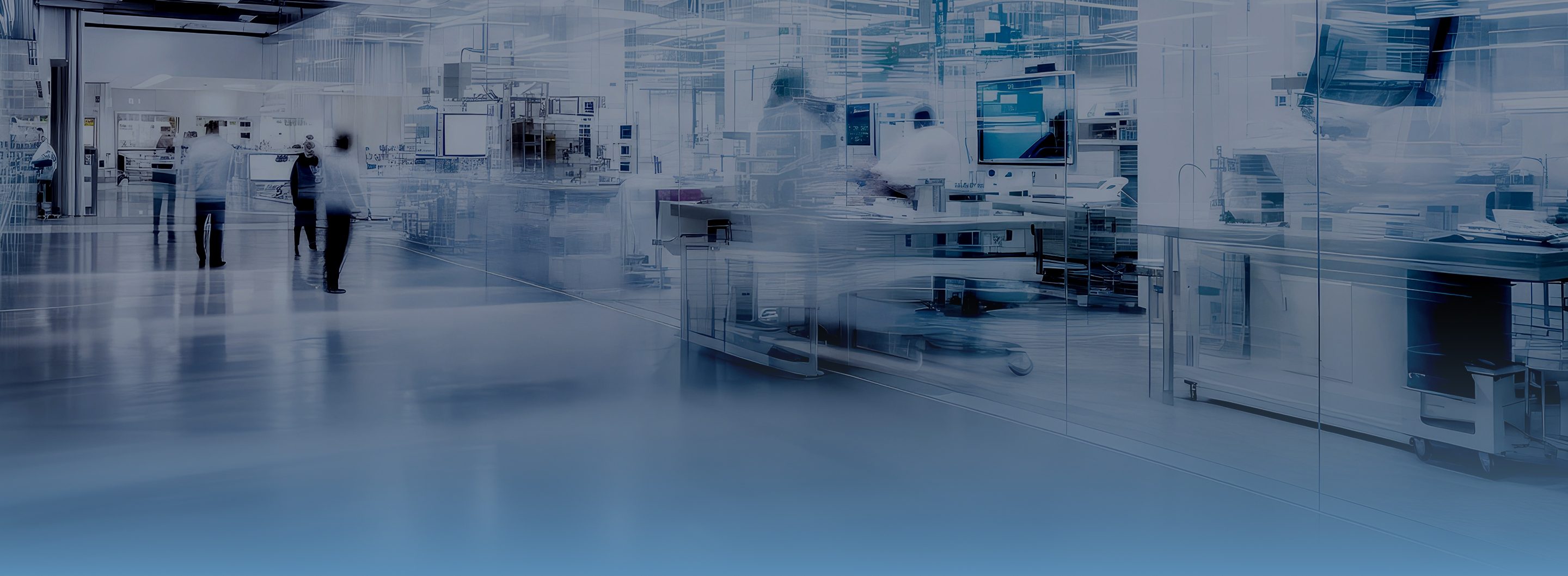 Modern cleanroom manufacturing lab with glass walls, stainless workstations, monitors, and technicians in blurred motion.