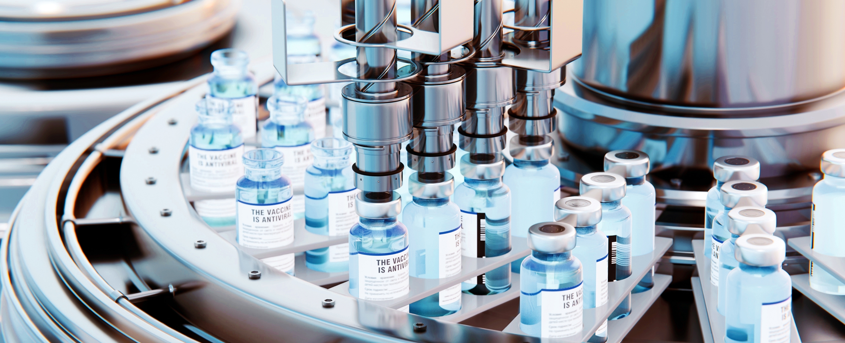 Automated pharmaceutical filling line dispensing into small glass vaccine vials on a circular conveyor in a sterile production facility.